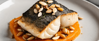 Roast hake with squash, carrot and almond purée
